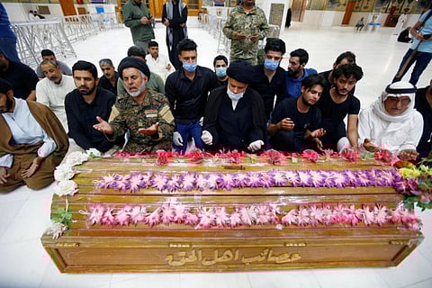 Mourners pray near the coffin of a member of Popular Mobilisation Forces, who was killed in clashes with Daesh militants in Salahuddin province, during the funeral in Najaf on May 3.