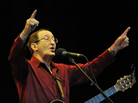 In this file photo taken on May 26, 2011 Algerian Kabyle singer, Idir, performs at the 10th edition of the Mawazine international music festival 'World Rythms' in Rabat, Morocco. 