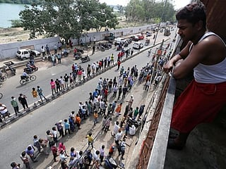 COVID-19: Indians queue for liquor as capital eases some coronavirus curbs