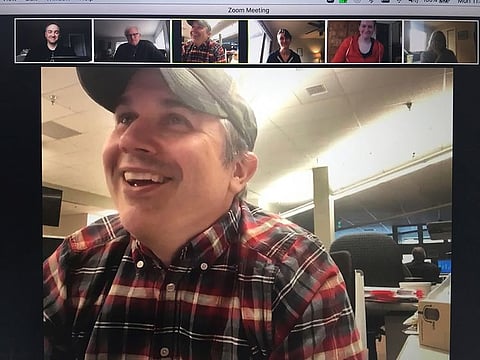Reporter Kyle Hopkins, bottom, and other staff members of the Anchorage Daily News receive word of the Pulitzer Prize for Public Service on a zoom call Monday, May 4, 202