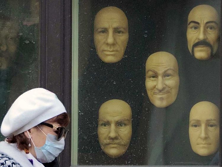 A woman wearing a face mask Russia wax faces