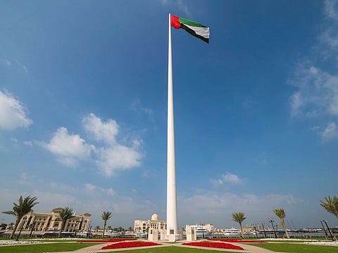 The UAE flag flutters at Flag Island in Sharjah.