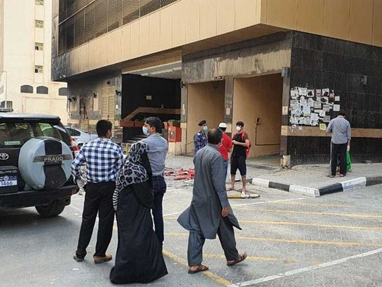 Residents outside the fire-hit Abbco Tower in Sharjah