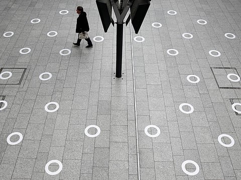 Plastic circles are seen on the ground indicating where to stand to respect social distancing at the Gare du Nord train station during the outbreak of COVID-19 in Paris, May 5.