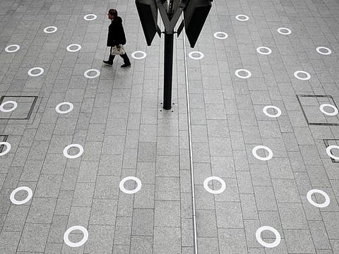 Plastic circles are seen on the ground indicating where to stand to respect social distancing at the Gare du Nord train station during the outbreak of COVID-19 in Paris, May 5.