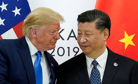 FILE PHOTO: U.S. President Donald Trump meets with China's President Xi Jinping.