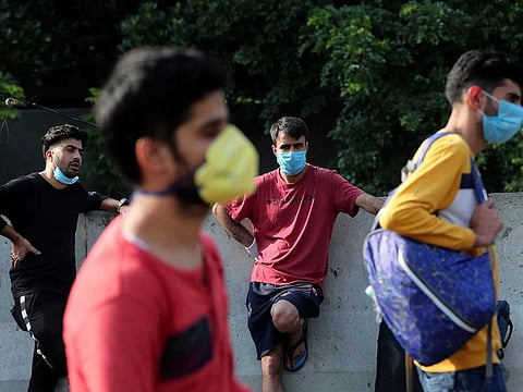 Kashmiri students stranded for weeks wait to board buses to a special train home during a lockdown to curb the spread of new coronavirus, in Bangalore, India, Sunday, May 10, 2020. 