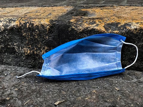 A discarded mask lies in a Beirut street, an image captured as part of a photographic project, titled "Invaders in Beirut" which consists of images of abandoned Personal Protective Equipment (PPE), in Lebanon. 