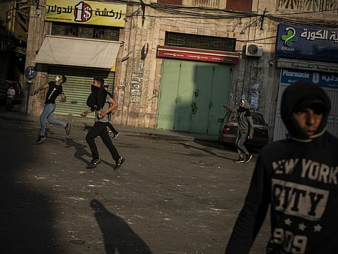 Antigovernment protesters clash with security forces in the northern city of Tripoli, Lebanon, April 29, 2020. Bad planning, corruption and the sudden shock of a pandemic have caused the Lebanese currency to crash and consumer prices to jump. 