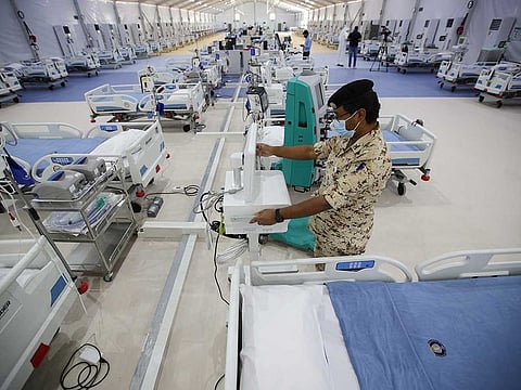 A Bahrain Defence Force medical personnel wearing a protective face mask works at a makeshift ICU "Field Intensive Care Unit 2 (Sitra)" set up by Bahrain authorities to treat the coronavirus disease (COVID-19) critical patients, at an island in Sitra, Bahrain, May 4, 2020.