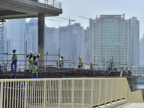 Construction workers hard at work during the afternoon Photo Clint Egbert/Gulf News