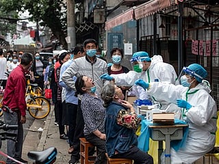 Crowds at Wuhan clinics fear coronavirus testing could rekindle COVID-19