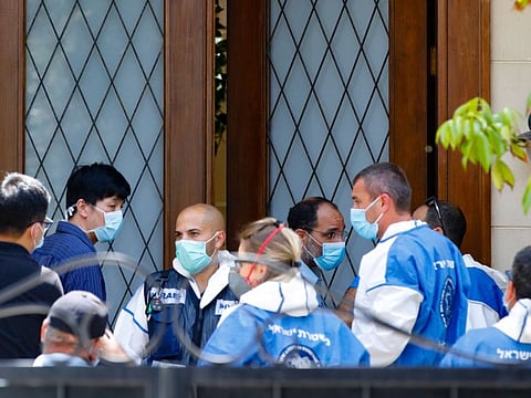 Medics gather in front of the residence of Israel's Chinese ambassador after he was reportedly found dead on May 17.