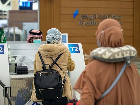 Passengers wait at the King Khaled airport in Riyadh for flying to Jakarta.