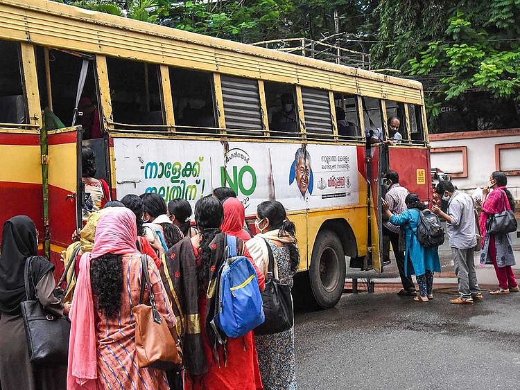 Kerala High Court employees board a bus