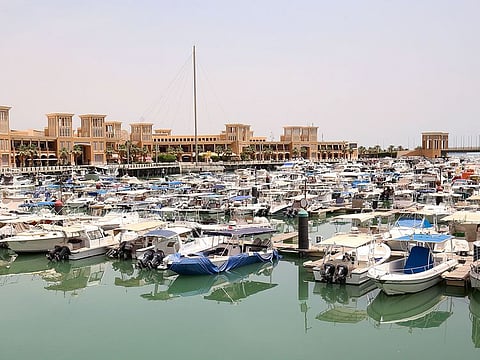 A view shows boats moored at the marina of Souq Sharq mall in Kuwait city during the 20-day nationwide lockdown due to the COVID-19 pandemic,