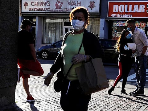 People gather in downtown amid the coronavirus disease (COVID-19) outbreak in Chelsea, Massachusetts, US, May 20, 2020. 