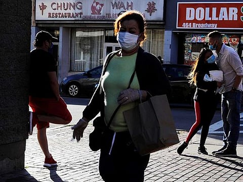 People gather in downtown amid the coronavirus disease (COVID-19) outbreak in Chelsea, Massachusetts, US, May 20, 2020. 