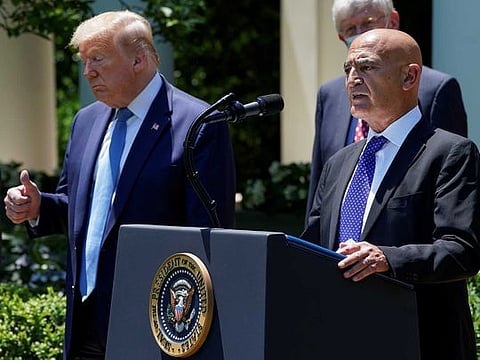 Former GlaxoSmithKline pharmaceutical executive Moncef Slaoui, who will serve as chief adviser on the effort to find a vaccine for the coronavirus disease (COVID-19) pandemic, speaks as US President Donald Trump listens during a coronavirus disease response event in the Rose Garden at the White House in Washington, US, May 15, 2020. 
