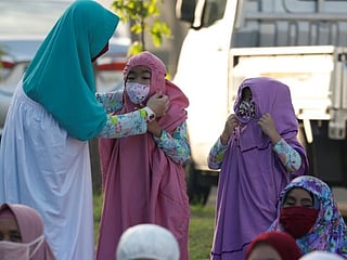 Soaring coronavirus infections dampen Eid Al Fitr festivities in Indonesia