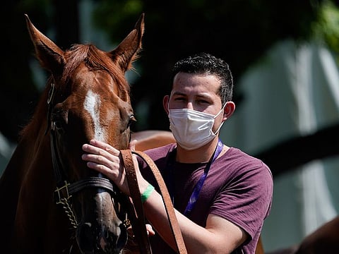 Jockeys and handlers are required to wear masks in the UK.