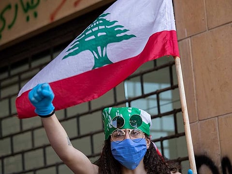 An anti-government protester shouts slogans during protests in front of the Ministry of Economy in downtown Beirut, Lebanon, on May 18, 2020.