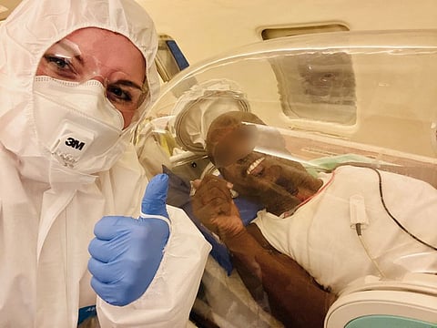 Karen James with a patient mid-flight 