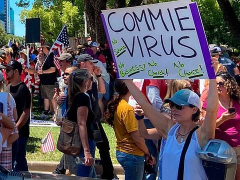 Protesters gathered outside the "Liberty Fest" rally in front of California State Capitol on May 23, 2020, in Sacramento, California, to protest Governor Gavin Newsom's Stay At Home Order to stem the coronavirus outbreak. 