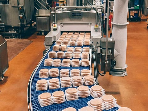 Plant-based burger patties on a production line at Impossible Foods in Oakland, California.