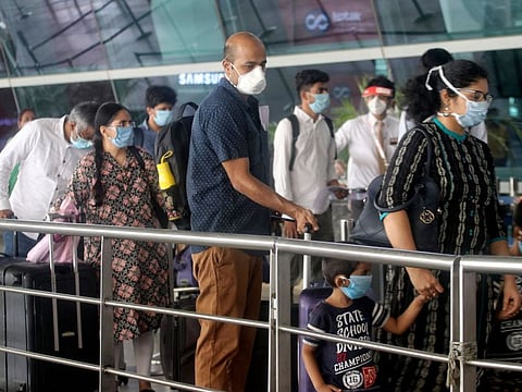 Passengers at the entrance to Indira Gandhi International Airport in New Delhi, following resumption of domestic flight services on Monday.