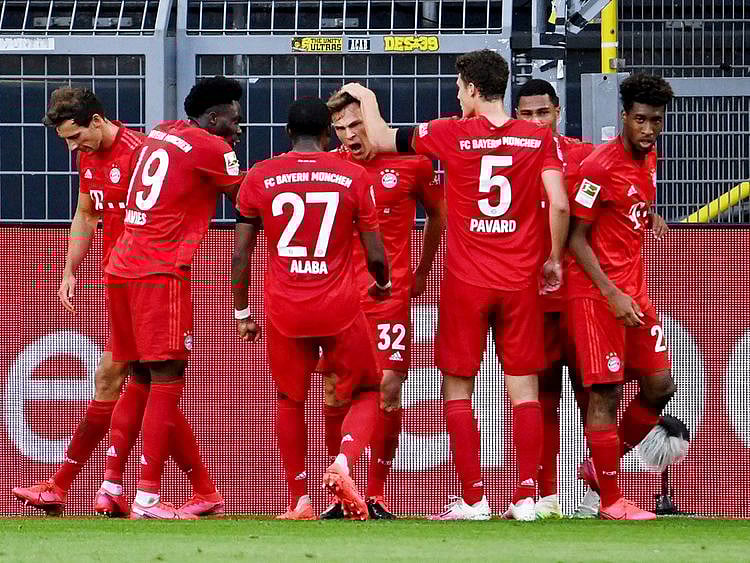 Bayern Munich's Joshua Kimmich celebrates scoring the only goal of the game against Borussia Dortmund