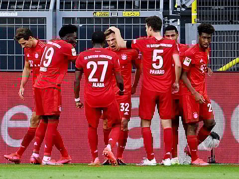 Bayern Munich's Joshua Kimmich celebrates scoring the only goal of the game against Borussia Dortmund