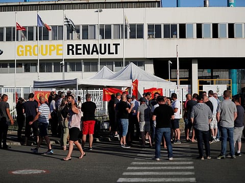 Renault workers gather in front of the Fonderie de Bretagne, a subsidiary of Groupe Renault, in Caudan, France, May 28, 2020. Picture taken May 28, 2020. REUTERS/Stephane?Mahe