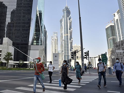 With restrictions finally eased and life returning to normal residents return to work in Dubai  