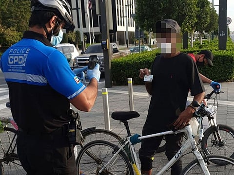 Dubai Police bicycle patrols check people's reasons for being out during the recent 24 hour national sterilisation programme