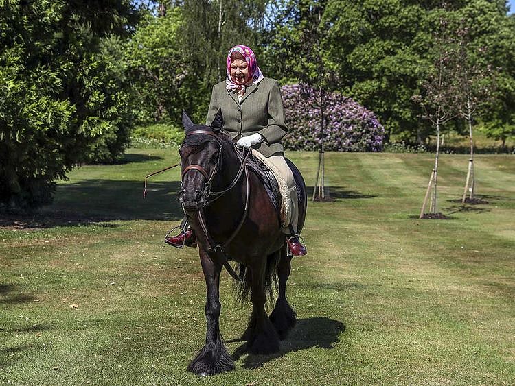 Britain's Queen Elizabeth II rides Balmoral Fern, a 14-year-old Fell pony, in Windsor