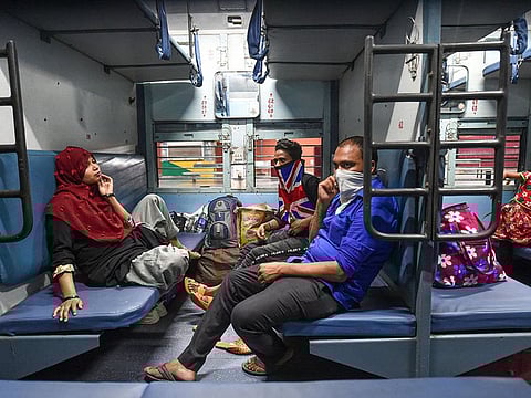 Passengers onboard a train at Charbagh railway station during COVID-19 lockdown 5.0, in Lucknow, Monday, June 1, 2020. Railways started its operation with 200 new trains from Monday, the first day of the 'Unlock 1' phase of the nationwide lockdown imposed to limit the spread of the Covid-19 coronavirus. 