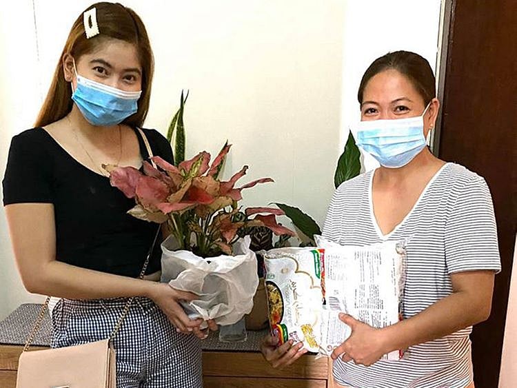 Residents swap items during the coronavirus pandemic