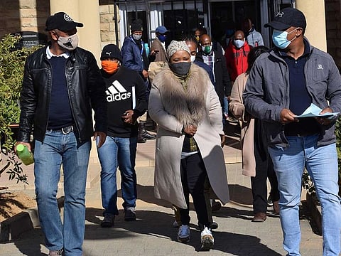 Former First Lady of Lesotho Maesaiah Thabane (2nd R) leaves the magistrate court in Maseru on June 3, 2020. Lesotho's former first lady Maesaiah Thabane was June 3, 2020, taken into custody following last week's court decision to cancel her controversial bail over the 2017 murder of her husband's estranged wife.