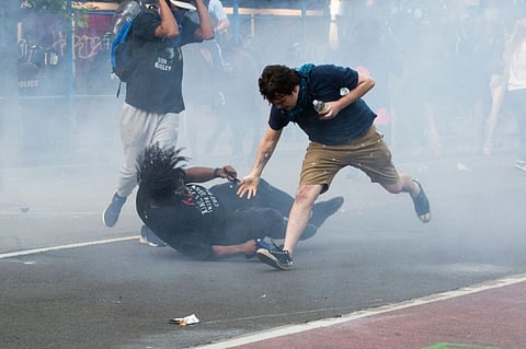 Protesters are tear gassed as the police disperse them near the White House on June 1, 2020 as demonstrations against George Floyd's death continue.  
