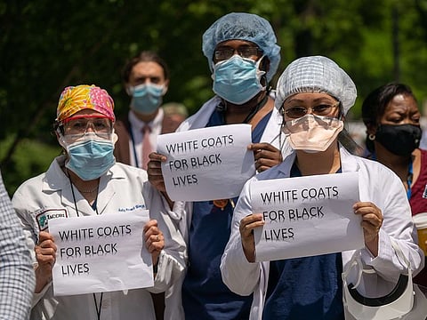 Healthcare workers show solidarity with the Black Lives Matter movement on June 4, 2020 in the Bronx borough of New York City. 