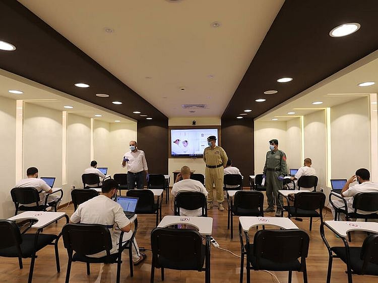 Dubai inmates taking the exams