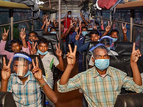 Migrants arrive at Birsa Munda International Airport by a special flight from Port Blair (Andaman and Nicobar Islands), during the ongoing COVID-19 lockdown, in Ranchi, Thursday, June 4, 2020.