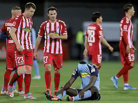Borussia Moenchengladbach's Marcus Thuram looks dejected after the defeat to Freiburg.