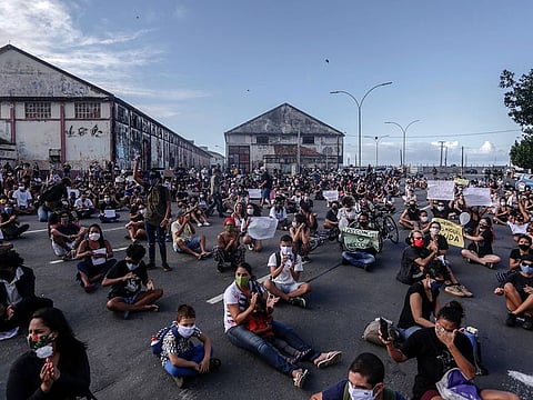 People demonstrate in demand of justice for the death of five-year-old Miguel Otavio Santana da Silva, the son of a black maid who on June 2 fell from the ninth floor of a building while under the watch of his mother's white employer, in Recife, Pernambuco State, in northeastern Brazil, on June 5, 2020.