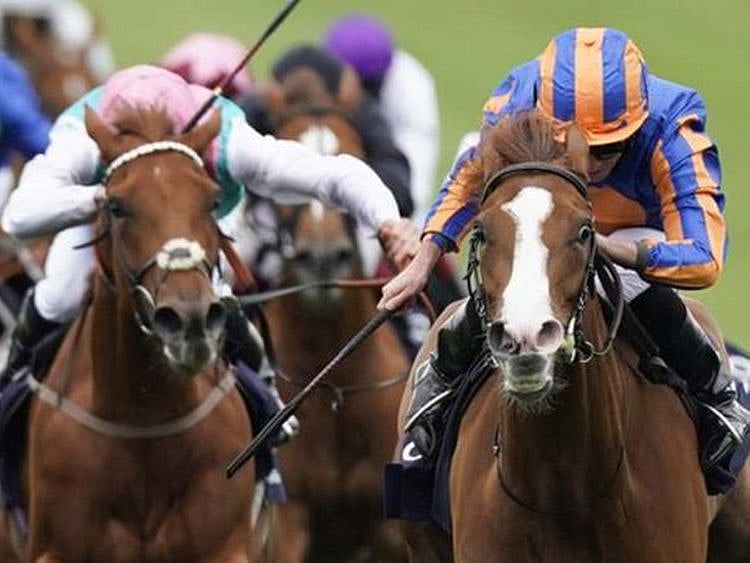 Love wins the 1,000 Guineas at Newmarket.