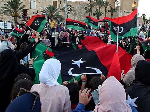People with Libyan national flags in the capital Tripoli's Martyrs' Square on June 5, 2020.