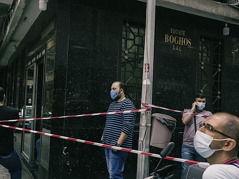 Businessmen line up outside a wholesale shop to sell gold in Beirut. The economic crisis and the sharp devaluation of Lebanon’s currency have pushed many people to the brink of poverty, forcing some to sell their gold jewelry. MUST CREDIT: Photo by Lorenzo Tugnoli for The Washington Post.