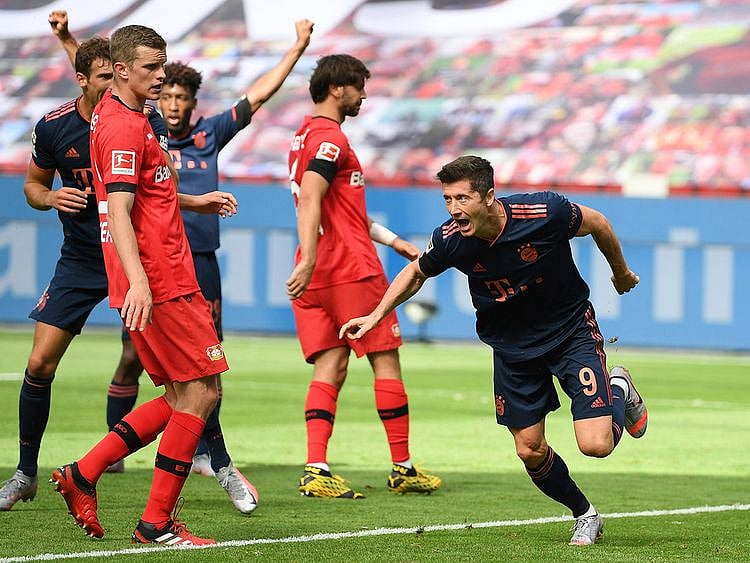 Robert Lewandowski celebrates scoring against Bayer Leverkusen.