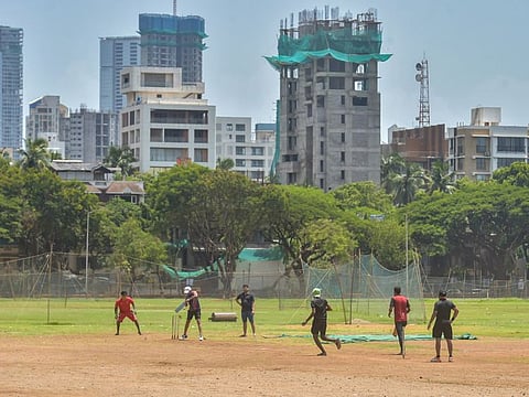 Youngsters play cricket at Shivaji Park ground, during the fifth phase of the ongoing COVID-19 nationwide lockdown, in Mumbai, Sunday, June 7, 2020. 
